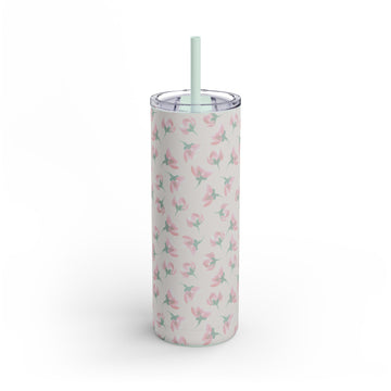 Tumbler with floral pattern and straw on a white background
