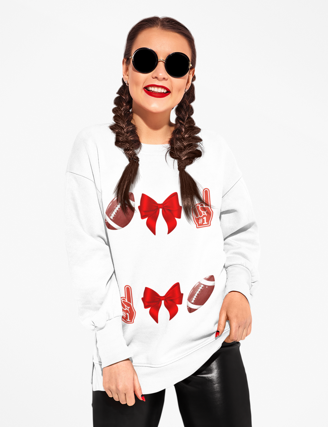 Woman wearing a white sweatshirt with red graphics on a white background
