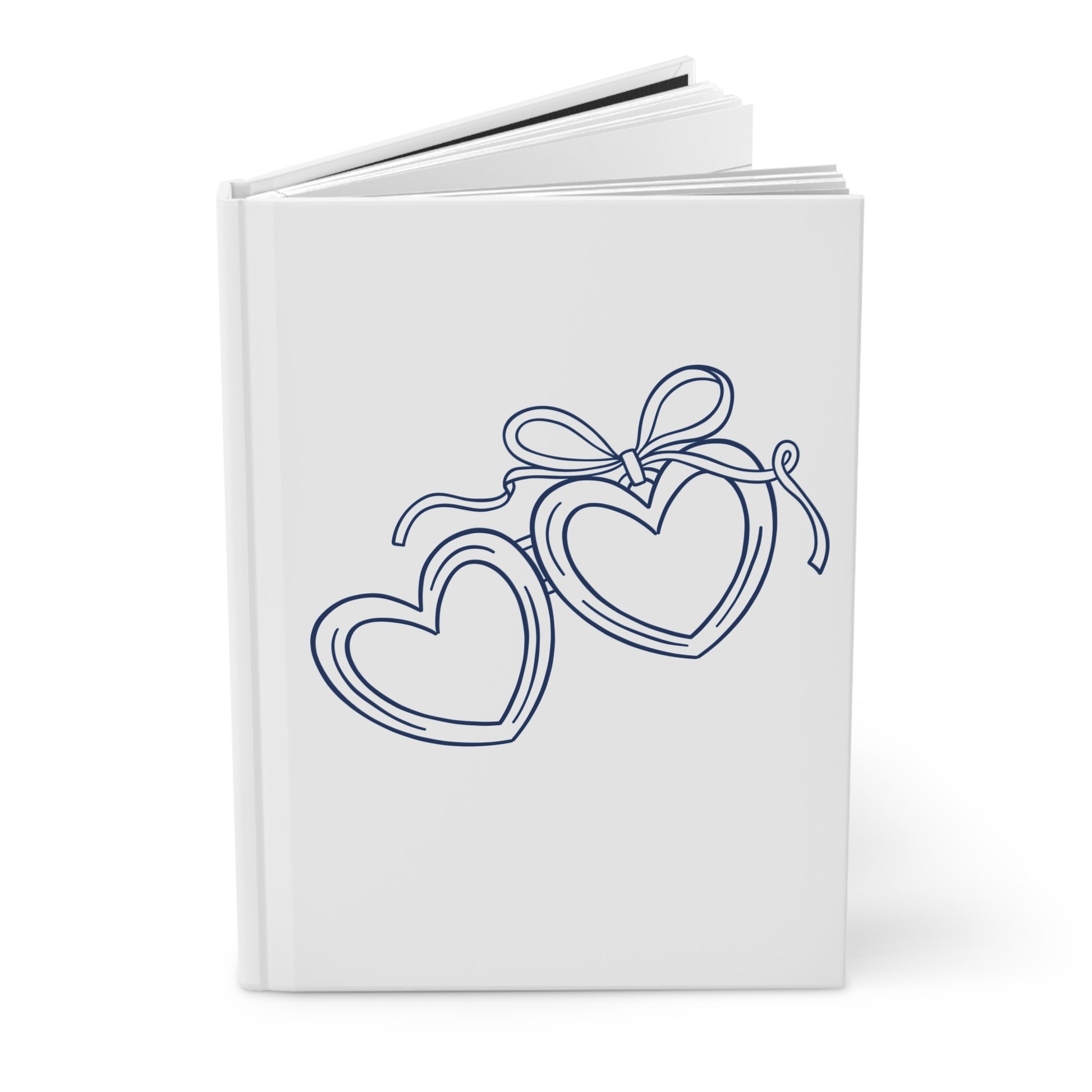 White notebook with blue heart design on a white background