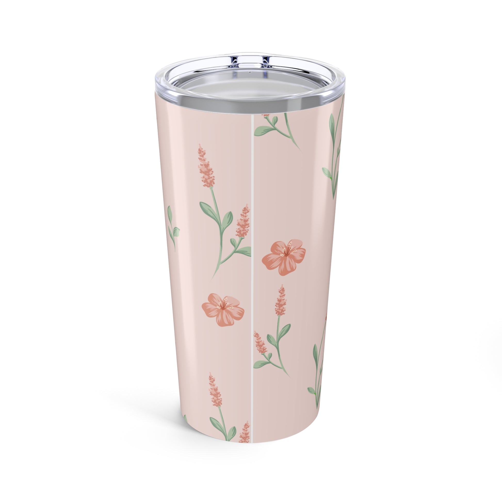 Floral-patterned tumbler on a pink background