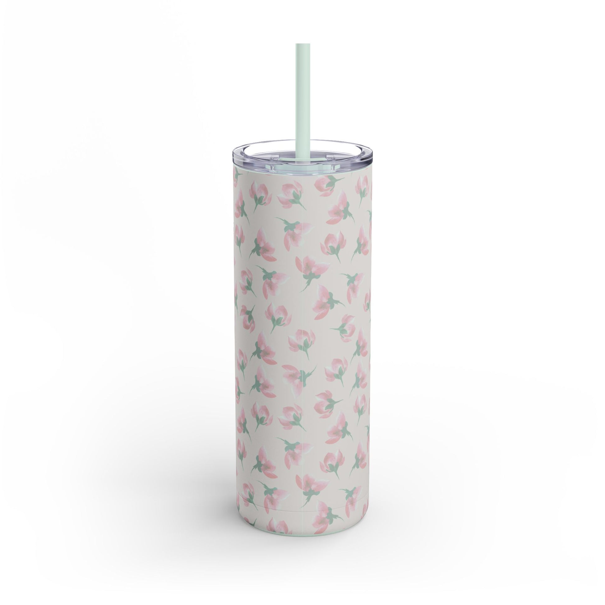 Tumbler with floral pattern and straw on a light pink background