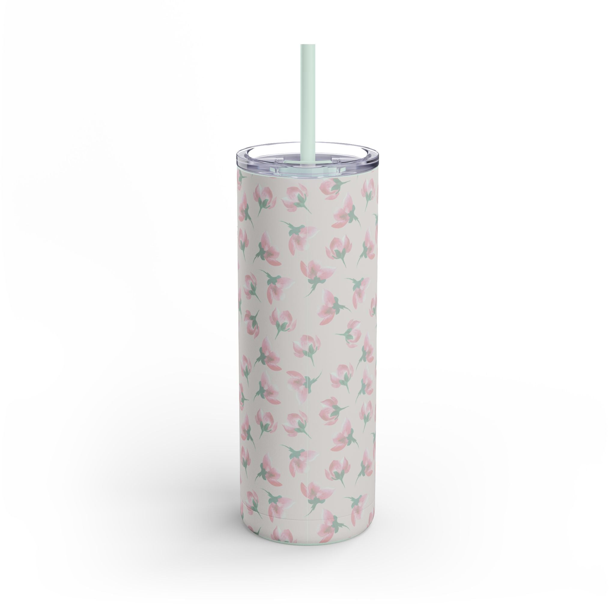 Tumbler with floral pattern and straw on a light pink background