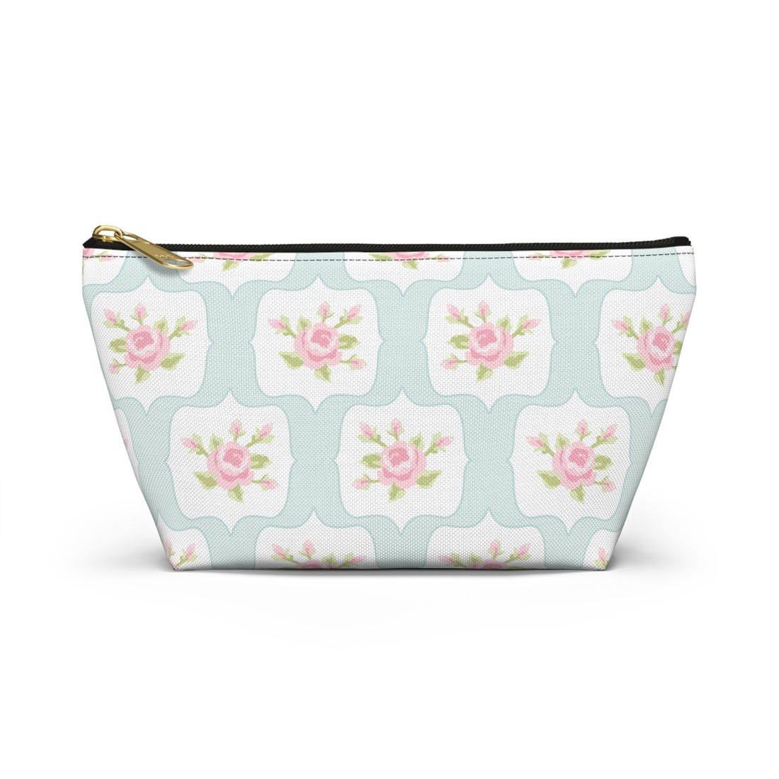 Floral patterned pouch with a gold zipper on a white background