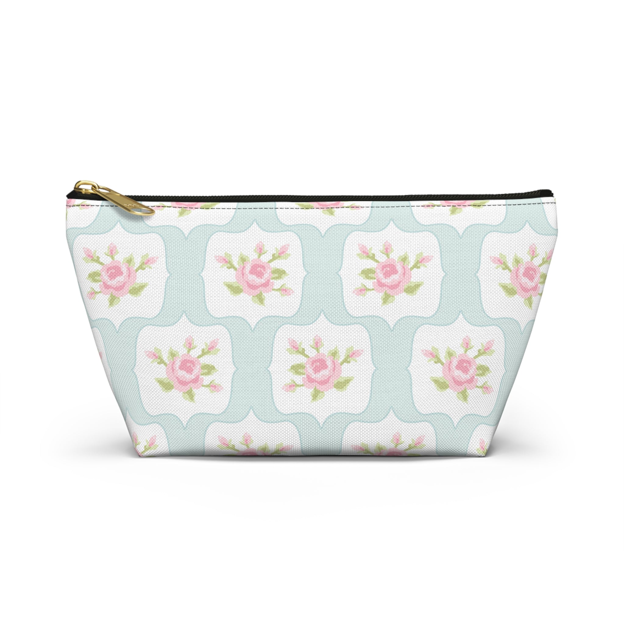 Floral patterned pouch with a gold zipper on a white background