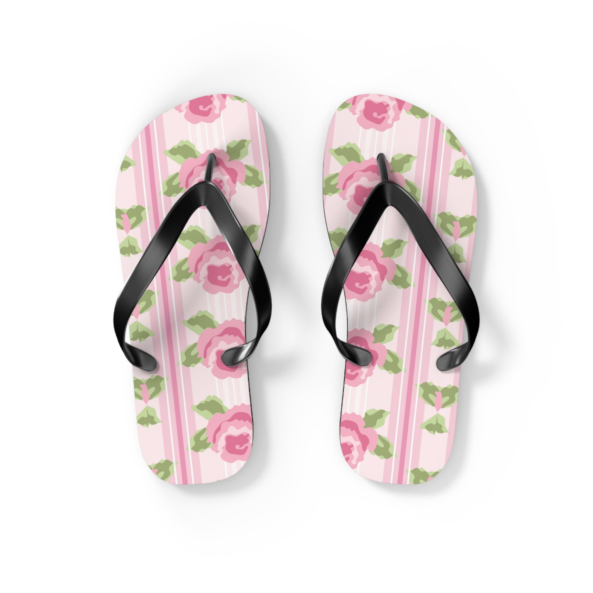 Pair of flip-flops with floral pattern on a light pink background