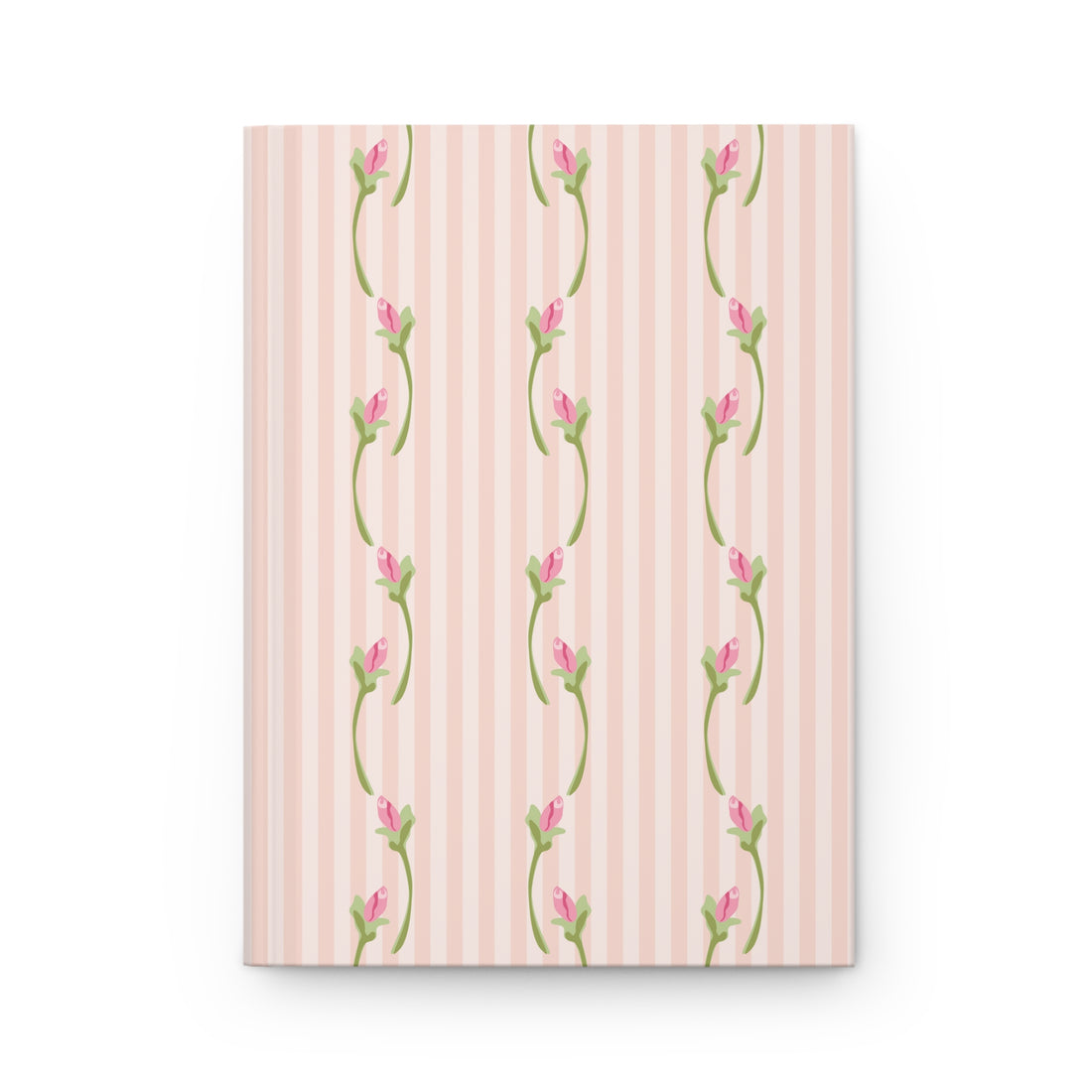 Notebook with floral design on a pink striped background