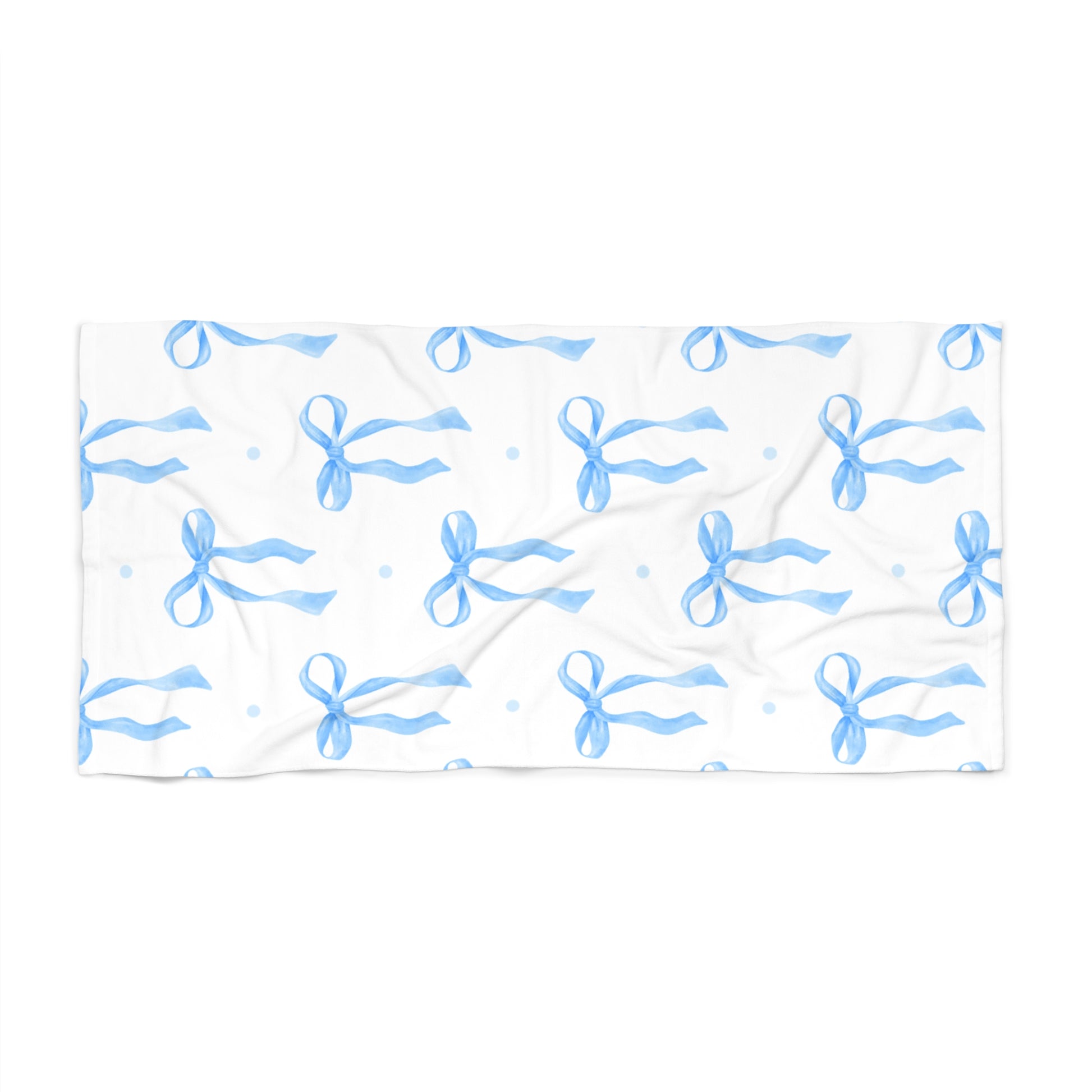 White towel with blue bow pattern on a white background