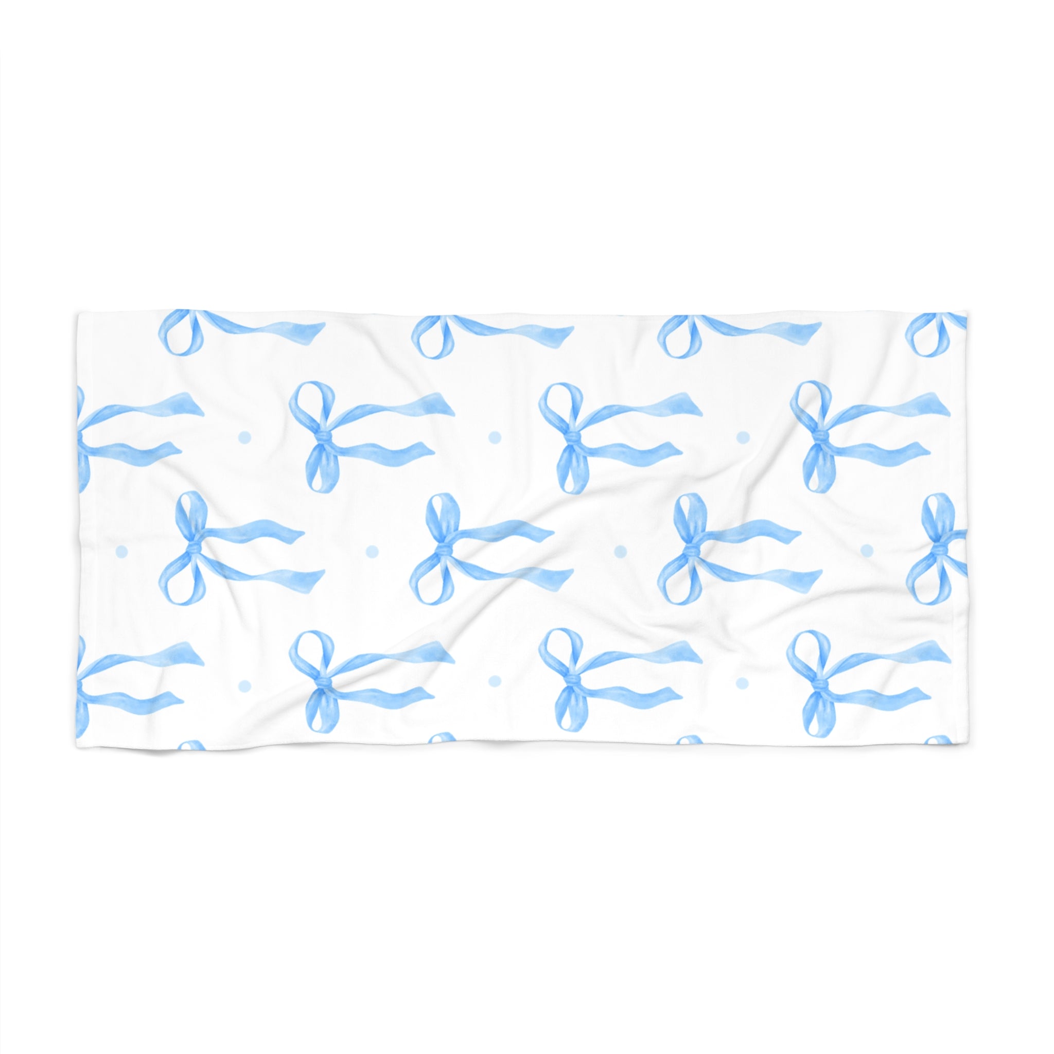 White towel with blue bow pattern on a white background