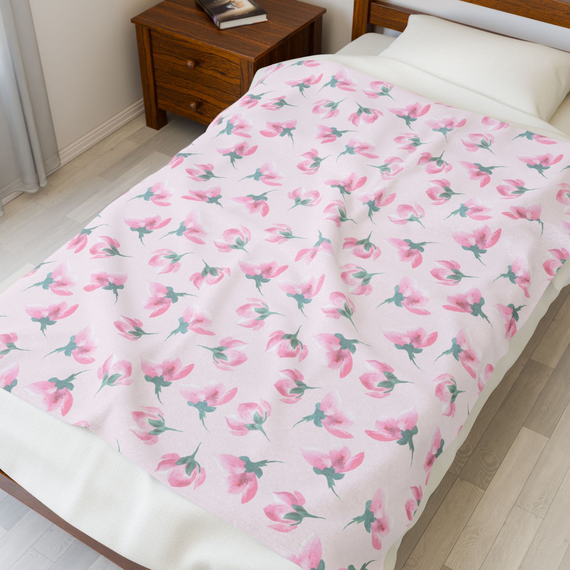 Floral patterned comforter on a bed in a bedroom setting