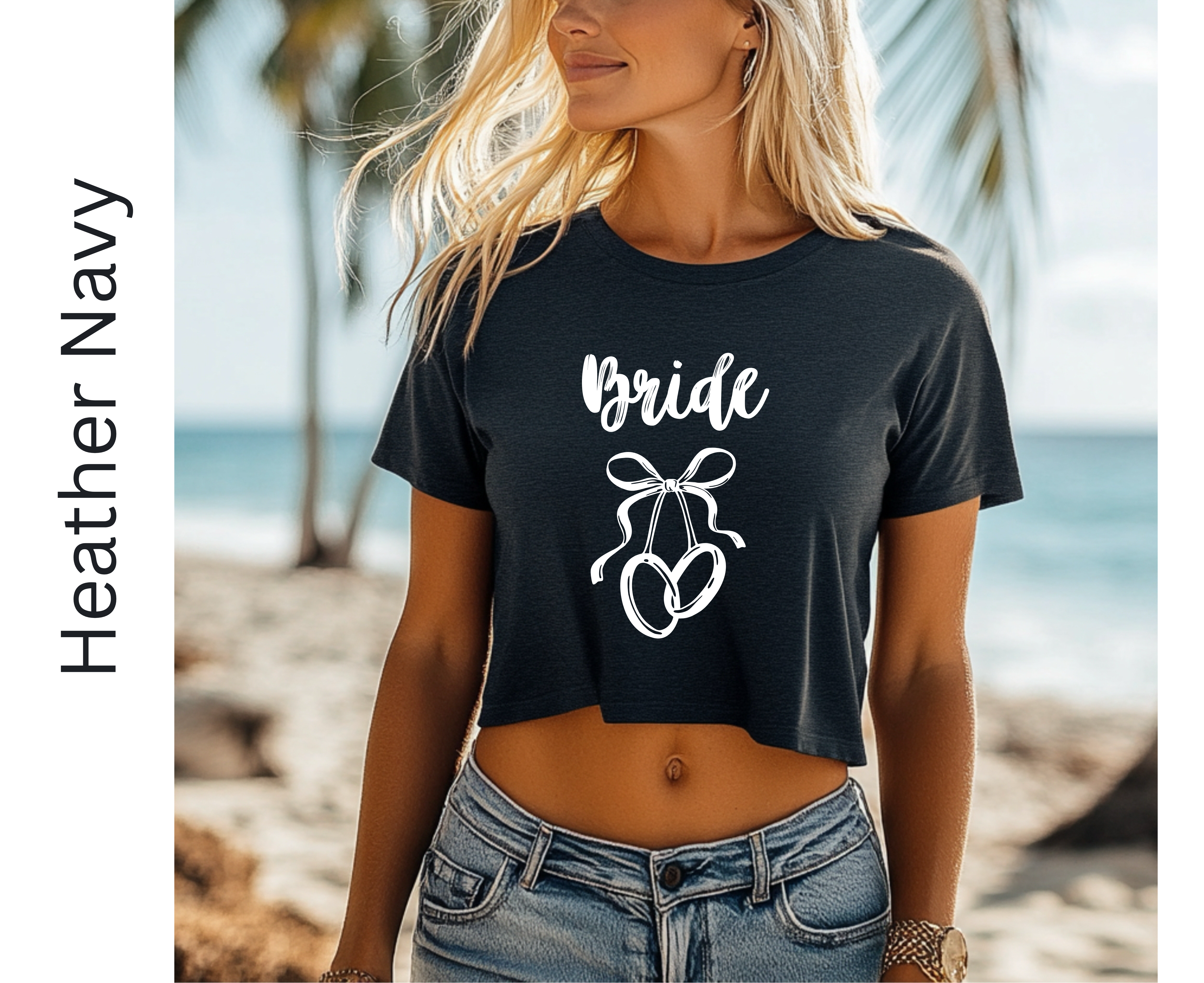 Woman wearing a black 'Bride' t-shirt with a bow graphic on a beach.