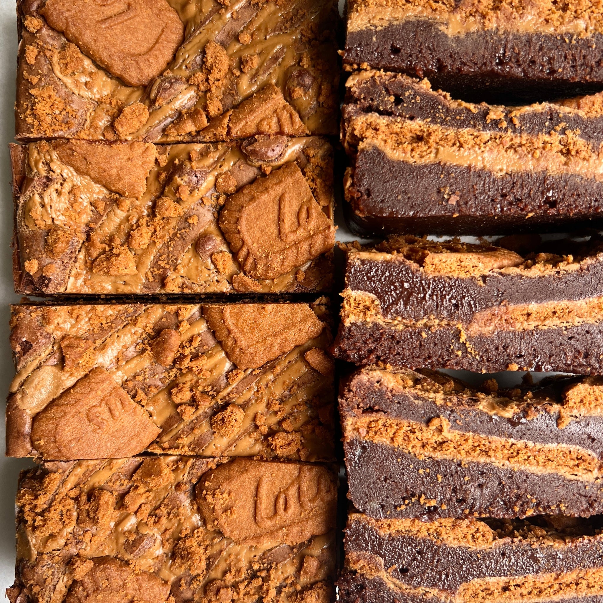 Brownies with Biscoff cookie pieces on a white background