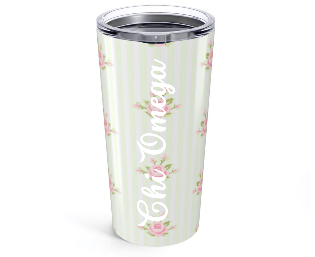 Tumbler with floral design on a white and green striped background