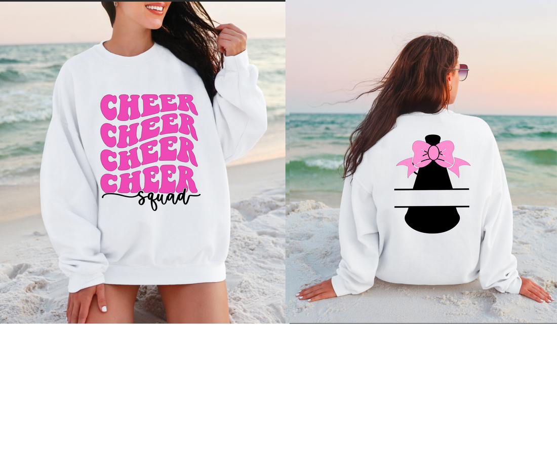 White sweatshirt with pink 'Cheer Squad' text and a customizable back design on a beach.