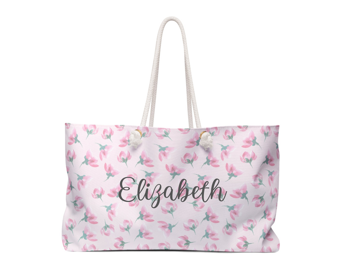 Floral patterned bag with white handle on a white background