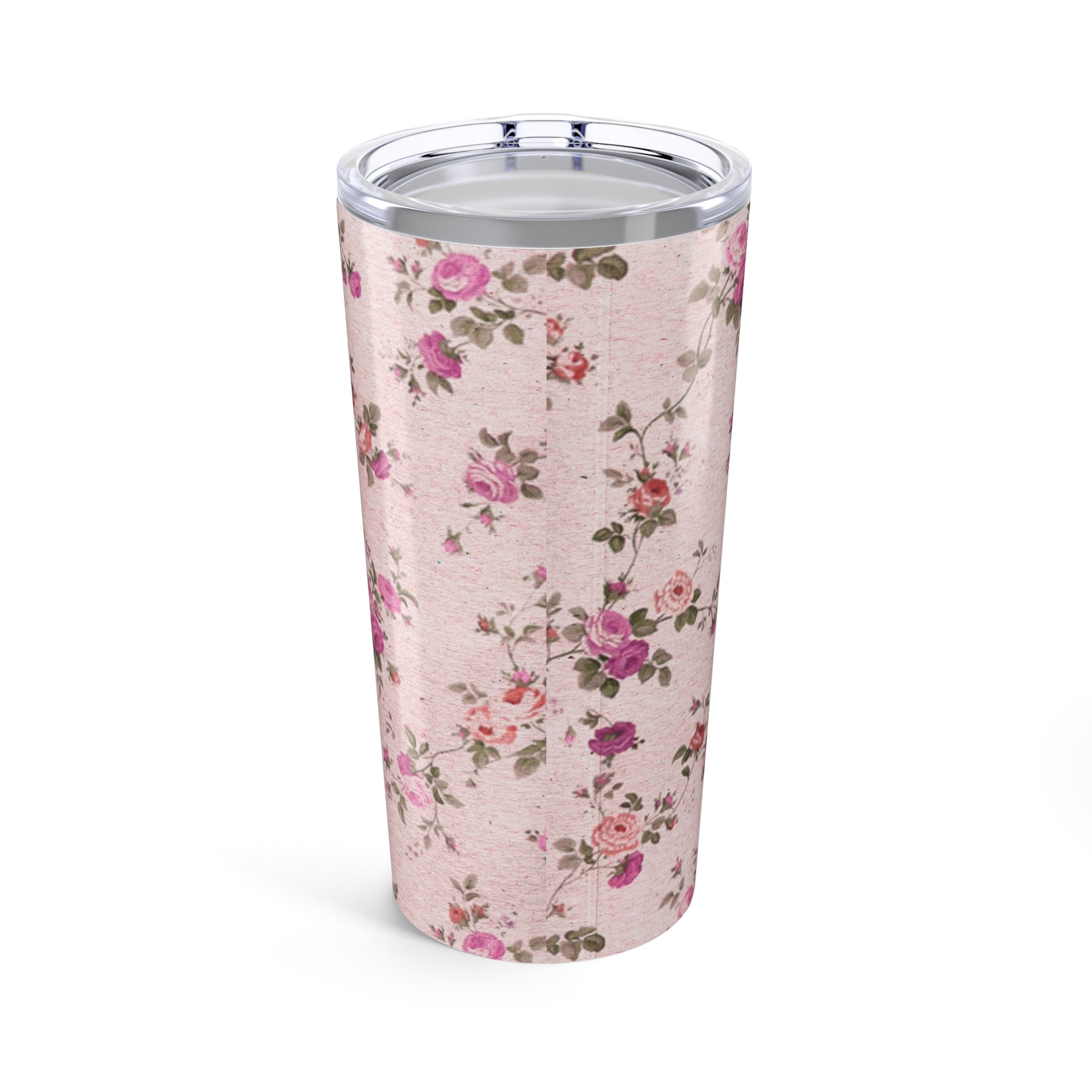 Floral-patterned tumbler on a pink background