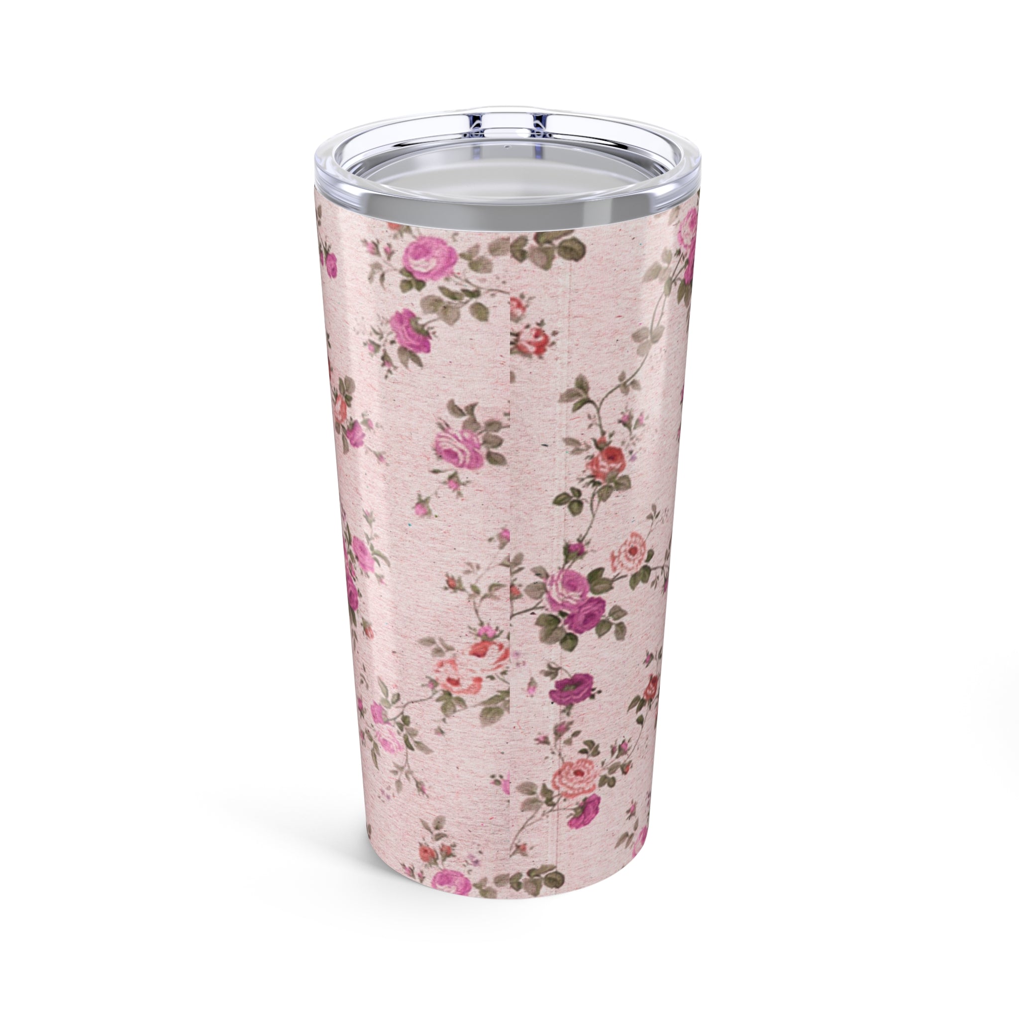 Floral-patterned tumbler on a pink background