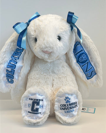 White plush bunny with Columbia University branding on a light gray background