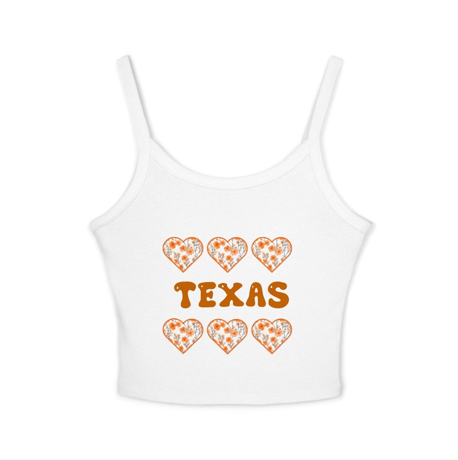 White tank top with 'TEXAS' and heart designs on a white background