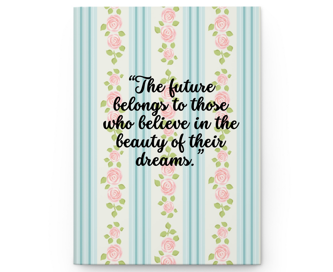 Notebook with pink floral pattern on a striped blue and white background