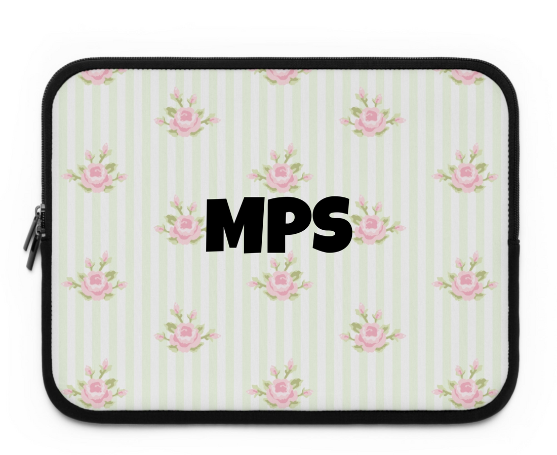 Person holding a floral patterned clutch bag against a white background