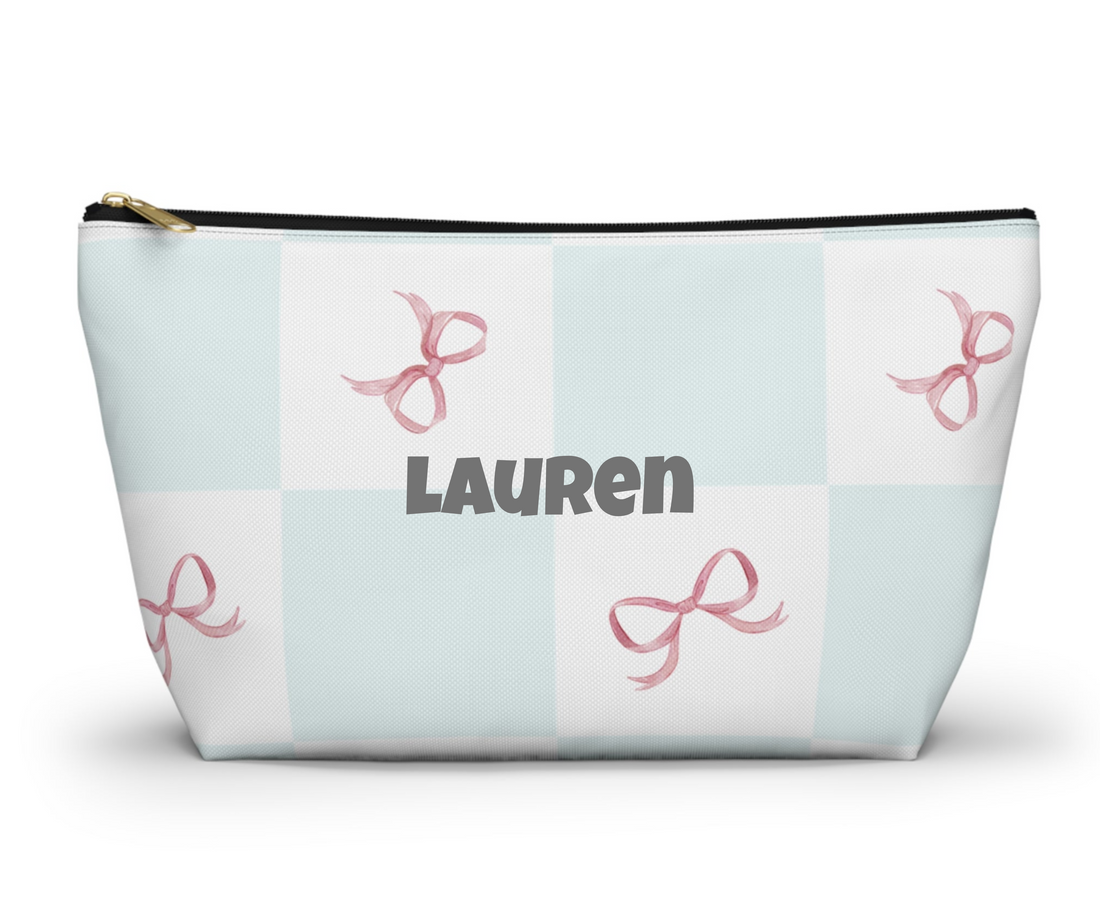 Cosmetic bag with pink bow pattern on a light blue and white checkered background