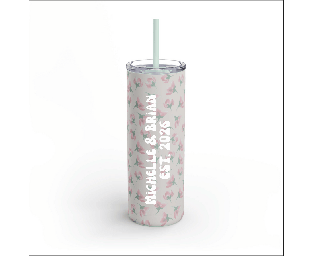 Tumbler with floral pattern and straw on a white background