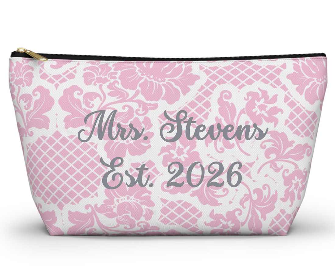 Pink and white patterned pouch on a white background