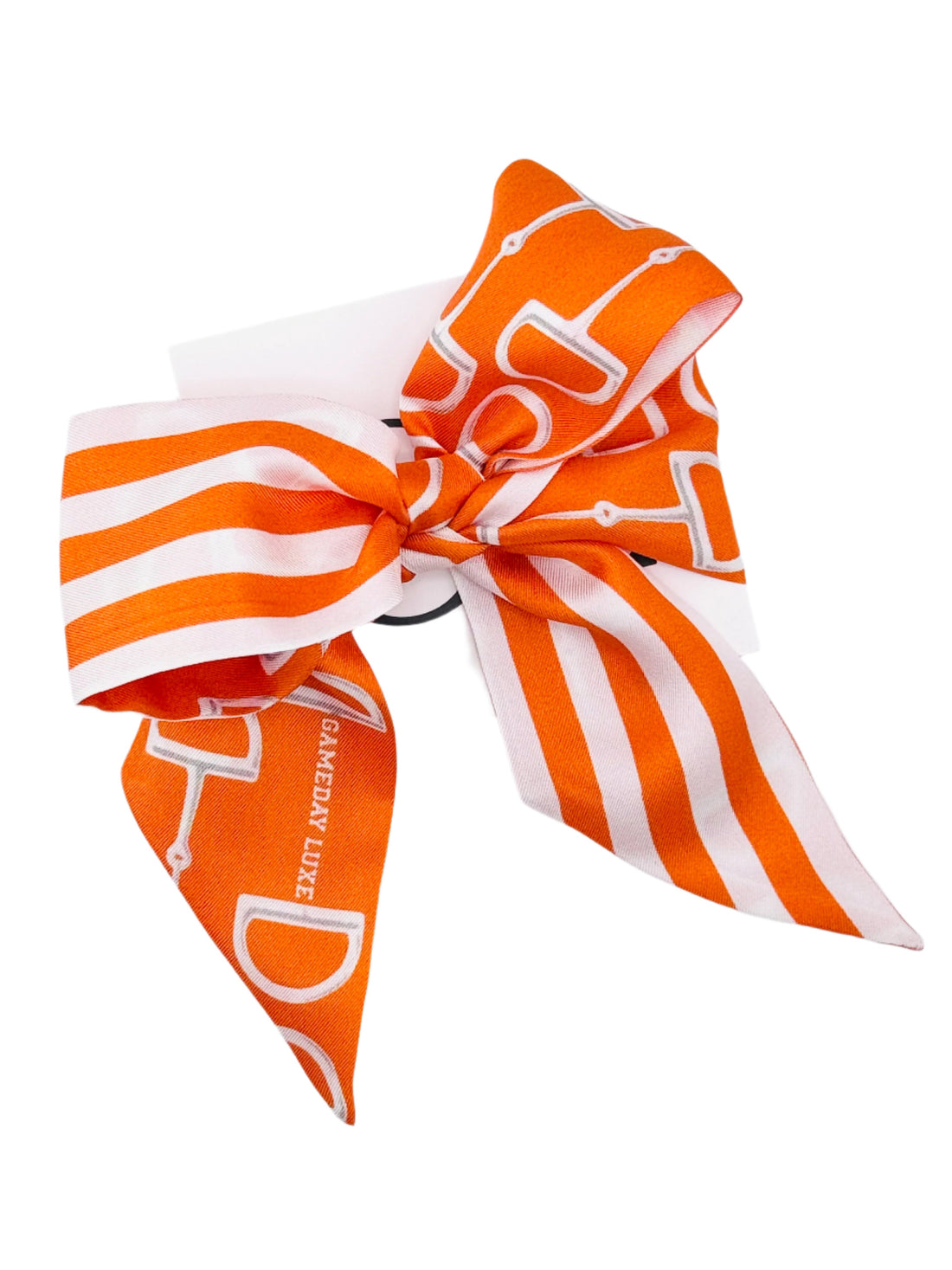Orange and white striped hair bow with a logo on a white background