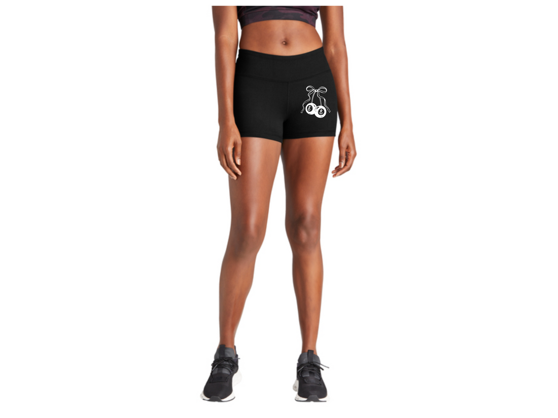 Person wearing black athletic shorts with a white logo on a white background