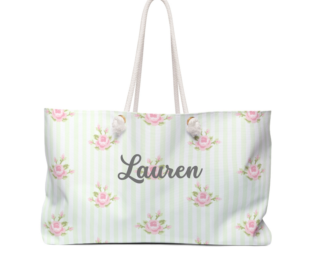 White tote bag with pink floral pattern on a white background