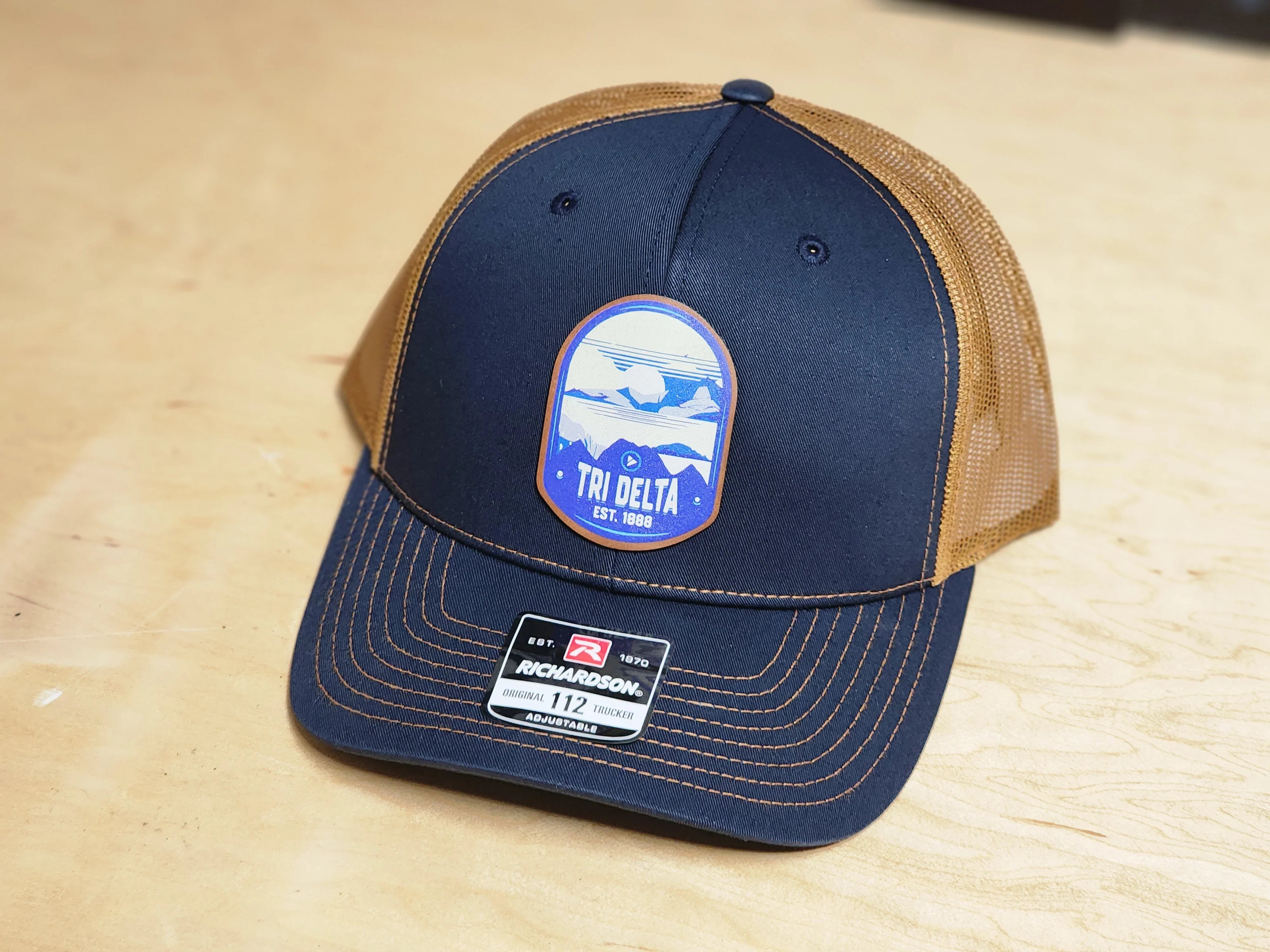 Tri Delta Richardson 112 UV Print Leatherette Patch Trucker Hat - Ventura