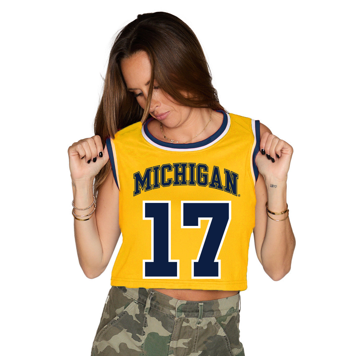 Woman wearing a yellow 'Michigan' tank top with the number 17 on a white background