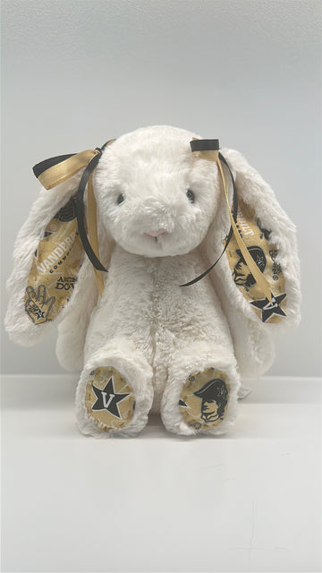 White plush bunny with gold bows and Vanderbilt logos on a white background
