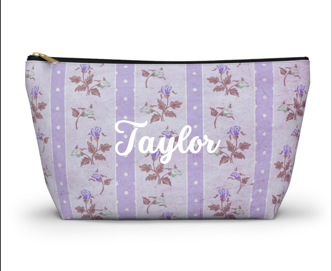 Floral patterned pouch with purple stripes on a white background