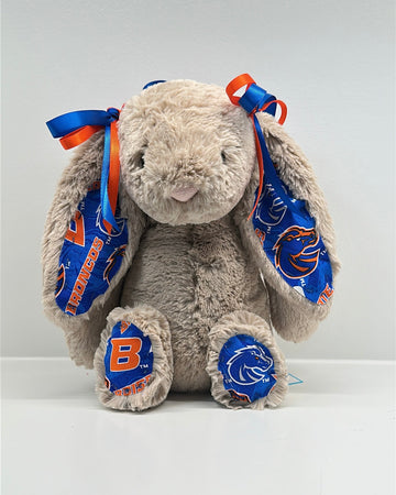 Plush bunny toy with blue and orange accents on a white background boise state
