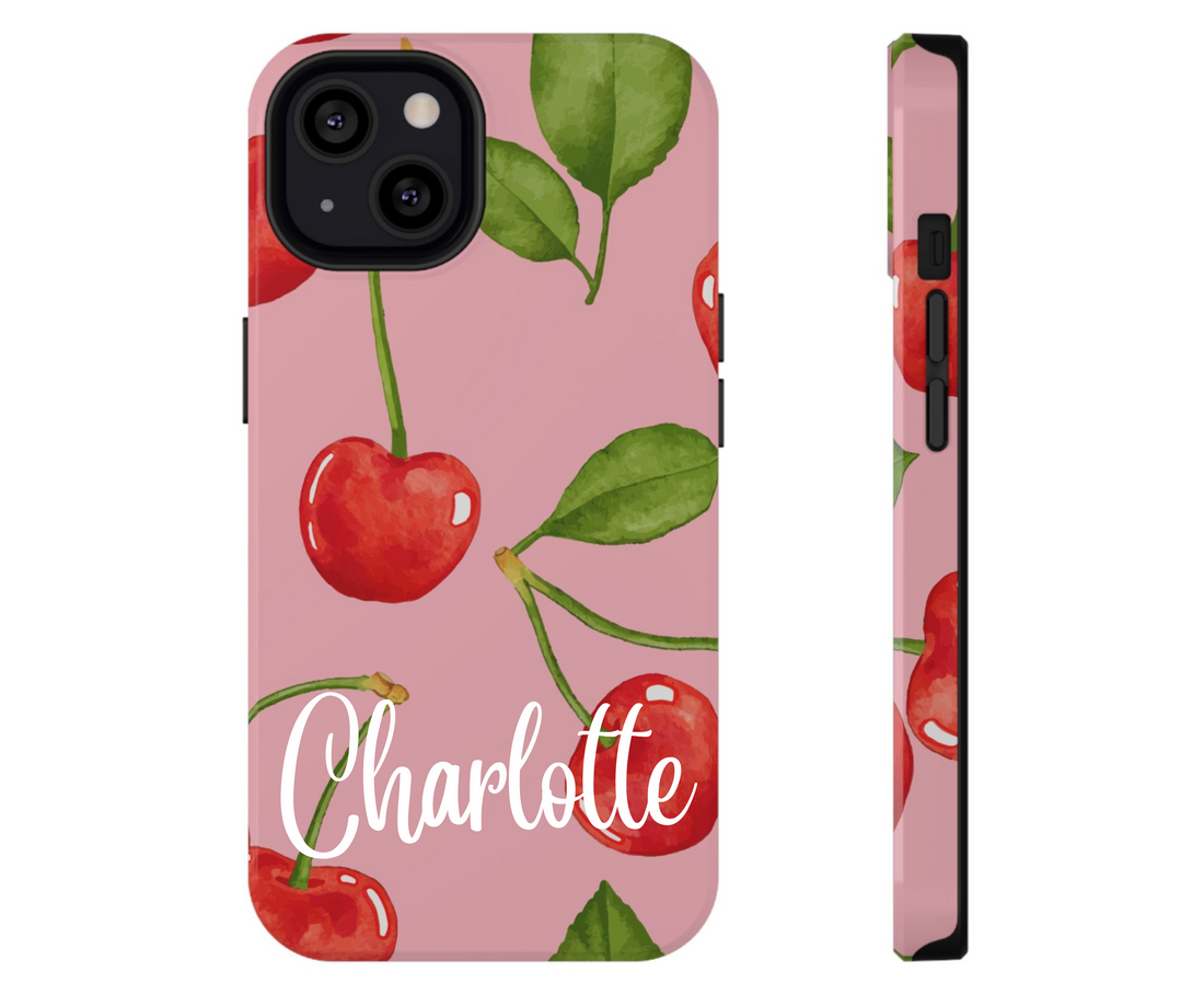 Phone case with cherry design on a pink background