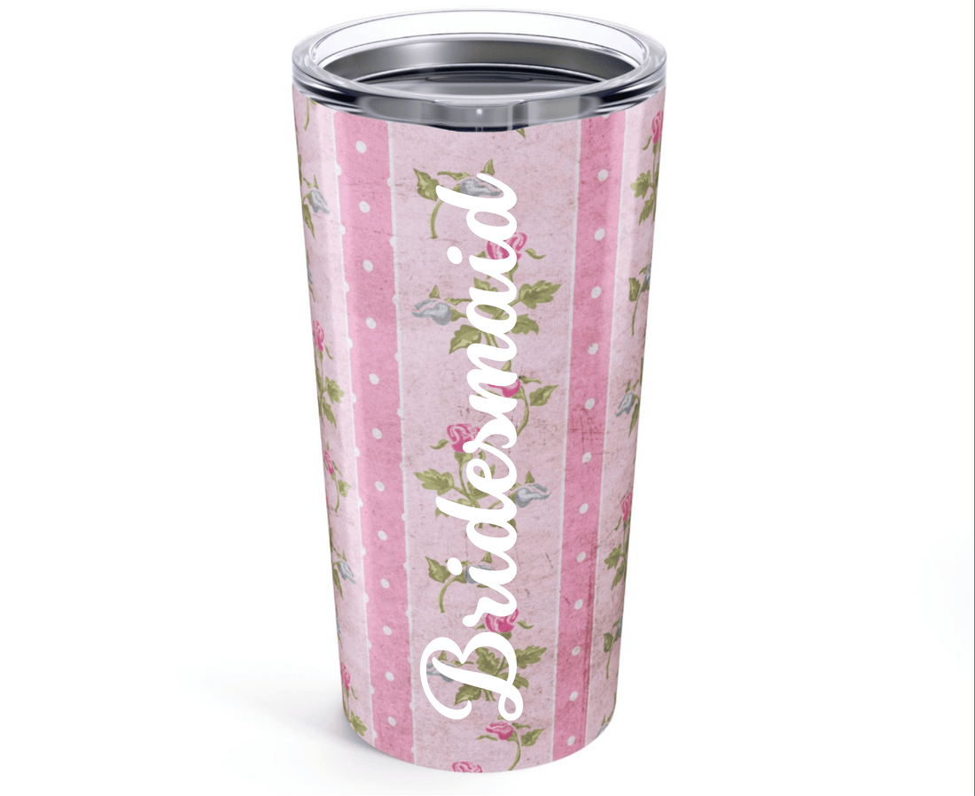 Tumbler with floral and polka dot pattern on a white background