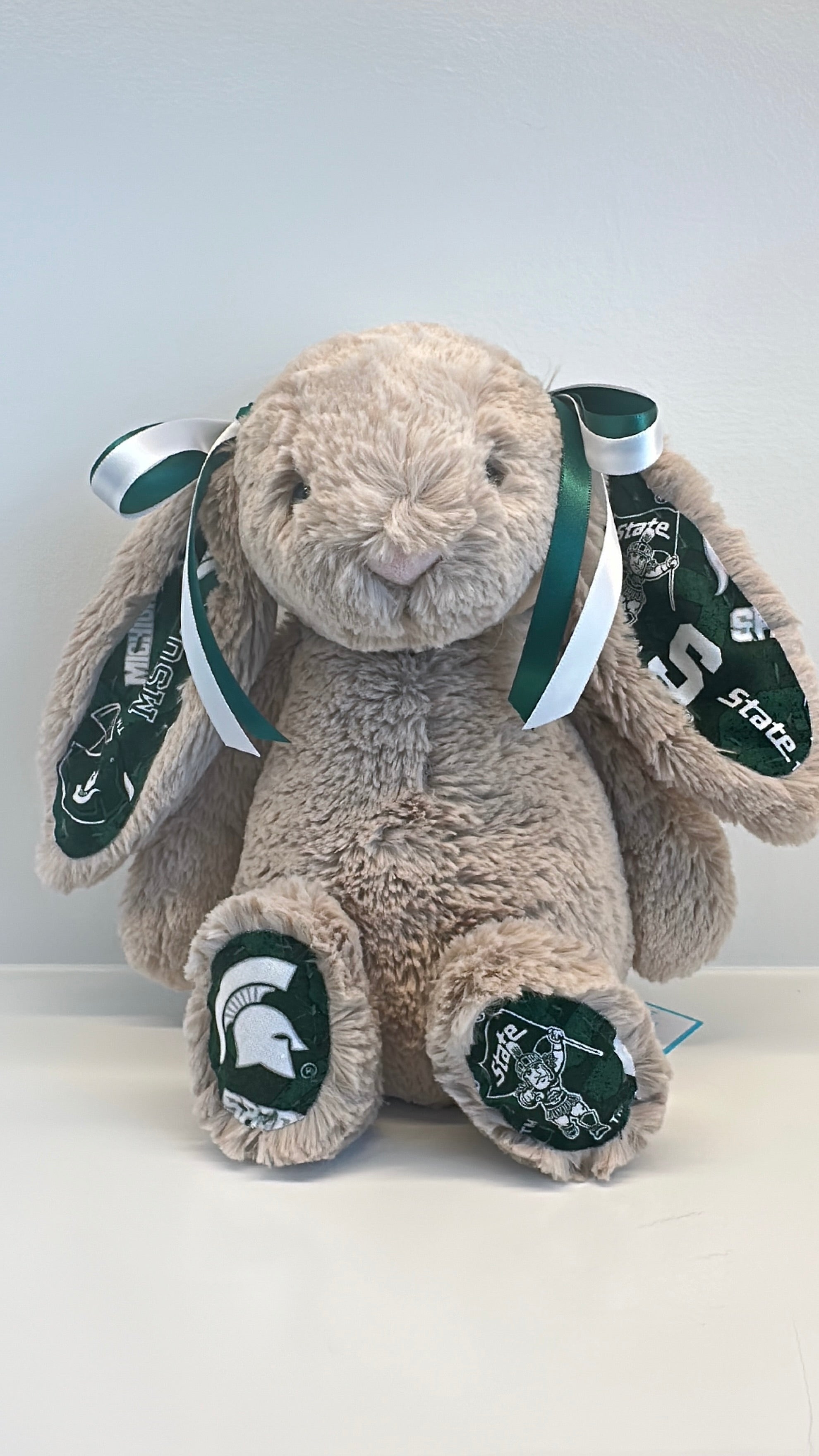 Plush bunny with Michigan State University logo on a white background