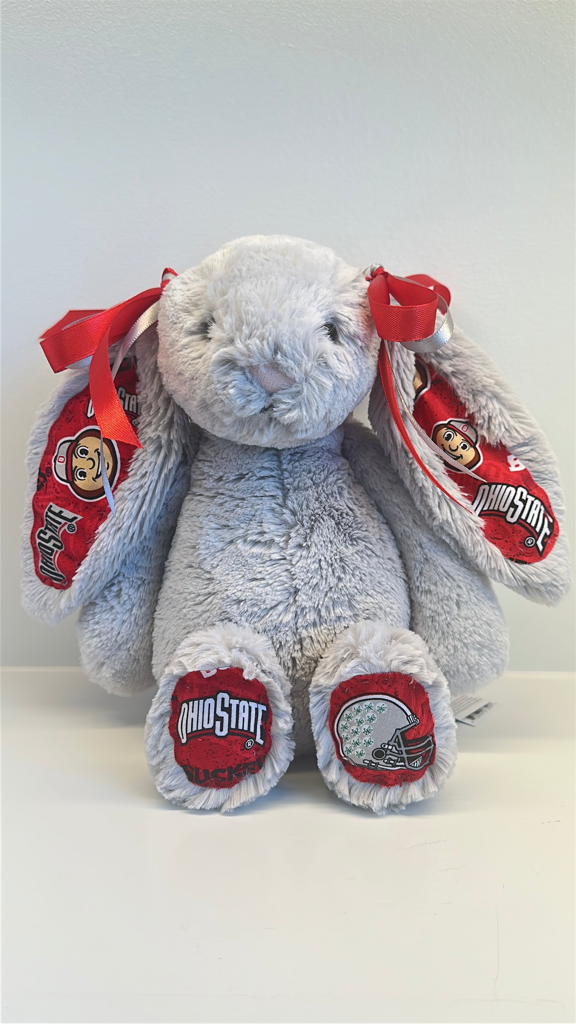 Gray plush bunny with Ohio State logo on a white background
