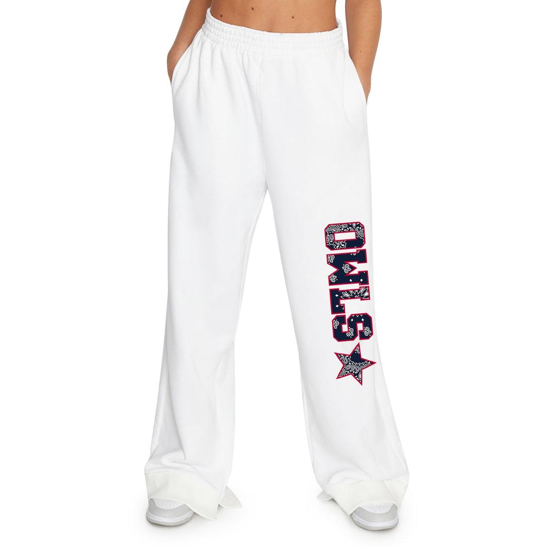 White sweatpants with black bandana patchwork with the word OWLS and a star going down the left pant leg
