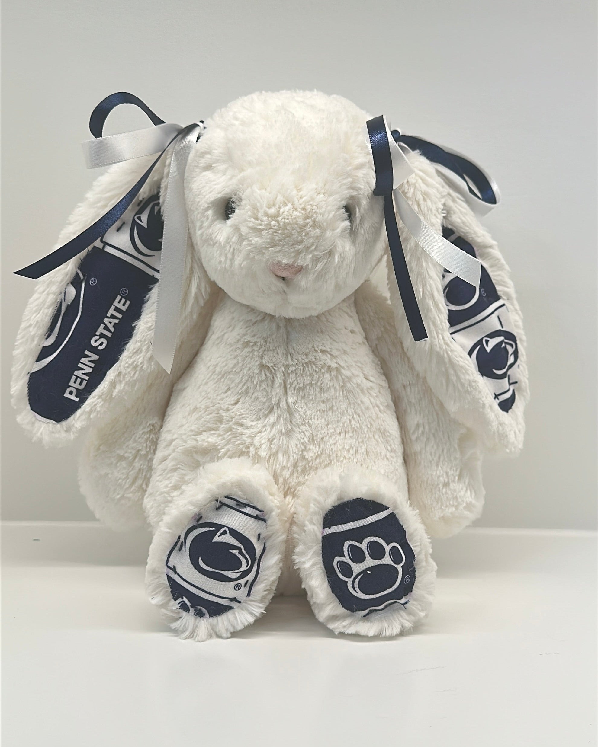 White plush bunny with Penn State logo on a white background