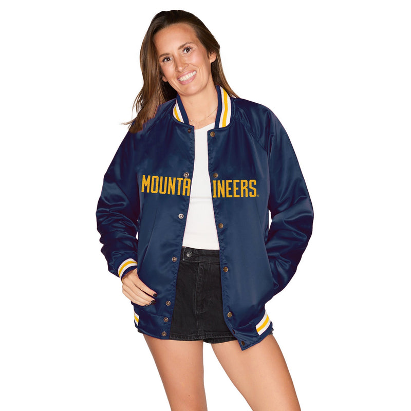 Woman wearing a navy blue jacket with 'Mountaineers' text on a white background